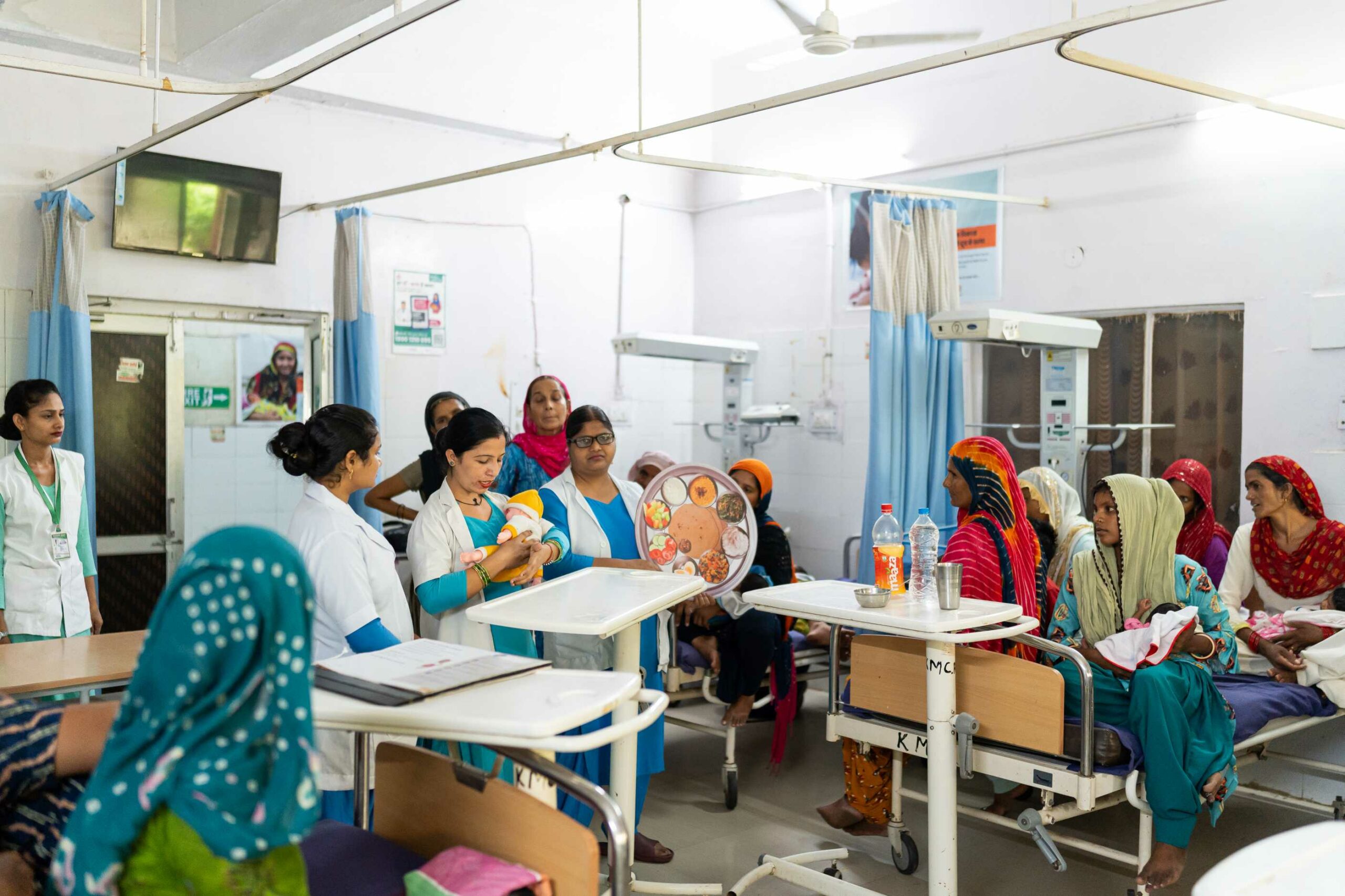 A healthcare worker demonstrates the "Thali Model" while explaining proper diet and nutrition during a Care Companion Program (CCP) session at a civil hospital in Jind, Haryana.