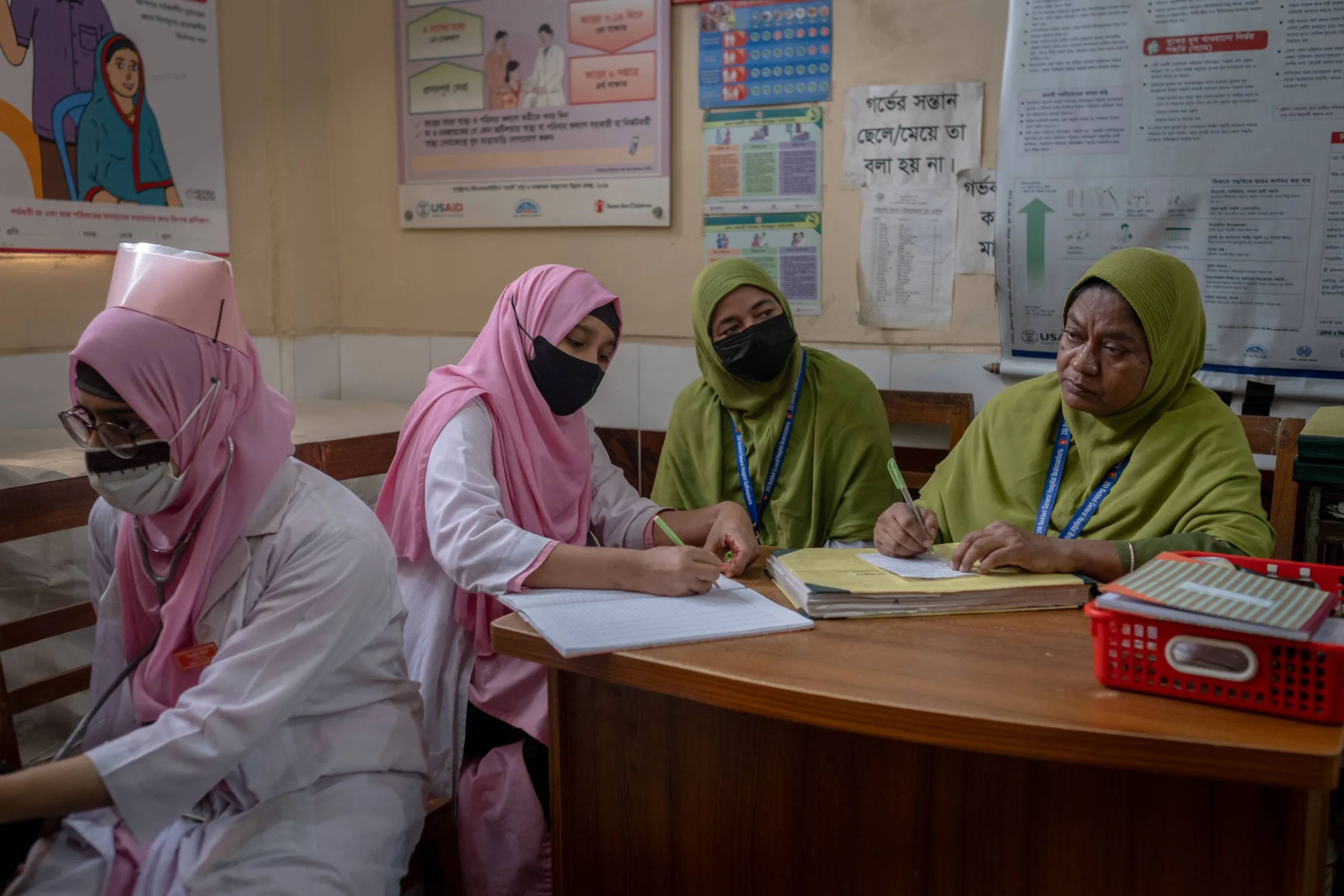 Mahamuda and some midwives conduct maternal health checkups.