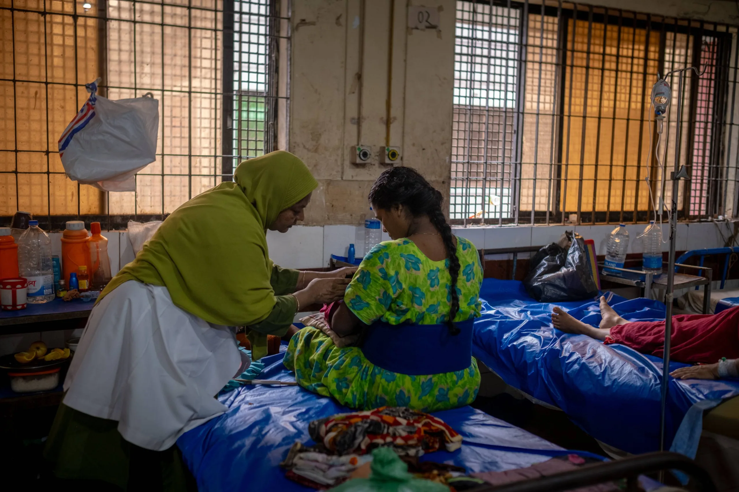  During her morning rounds, Mahamuda stops to check in on a new mother and her baby. 