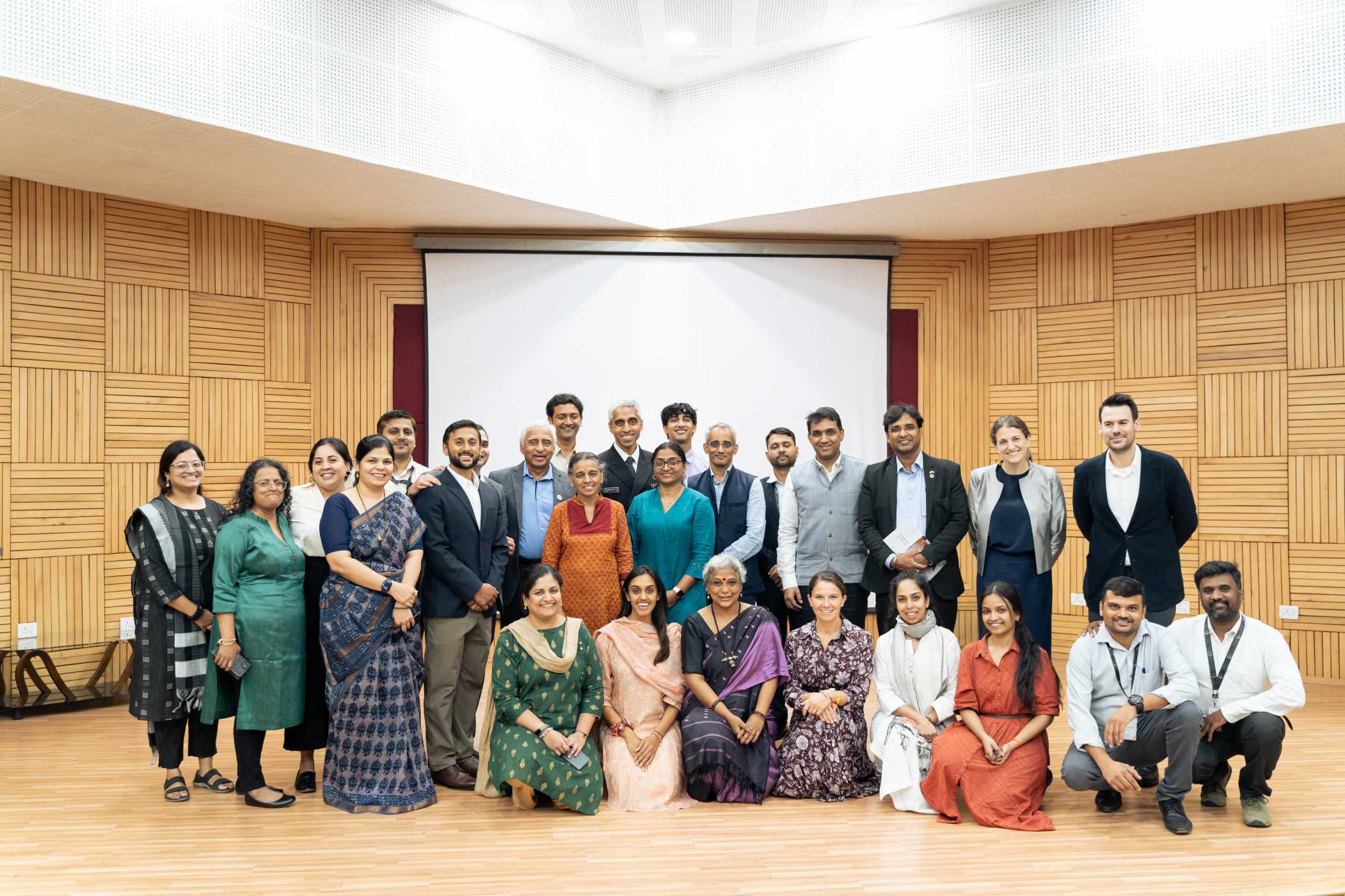 It takes a family! Dr. Murthy, his family, members of his team, and guests from the U.S. Consulate pose for a photo with the Noora Health team.