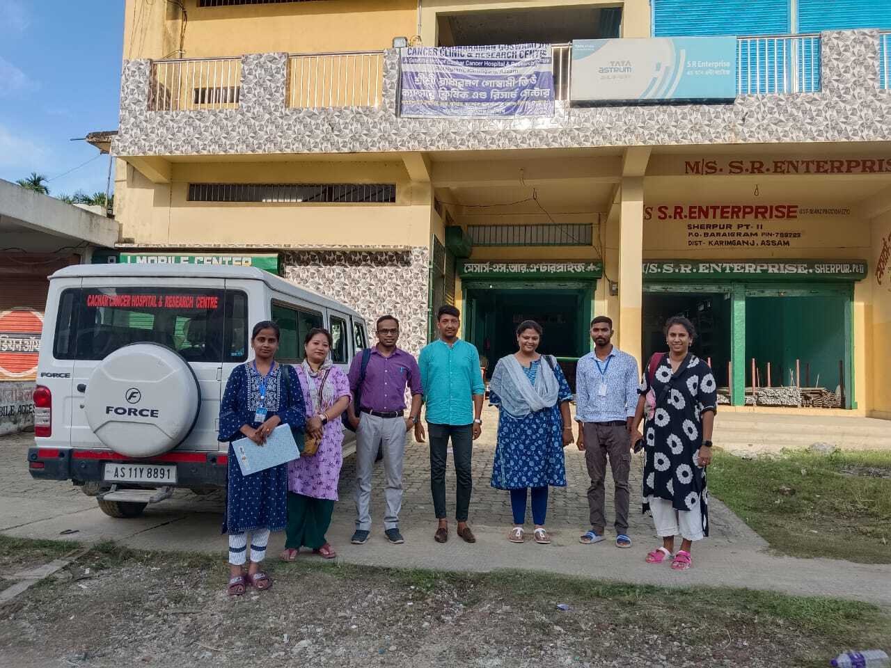 The Noora Health team with Biplob outside a satellite clinic.