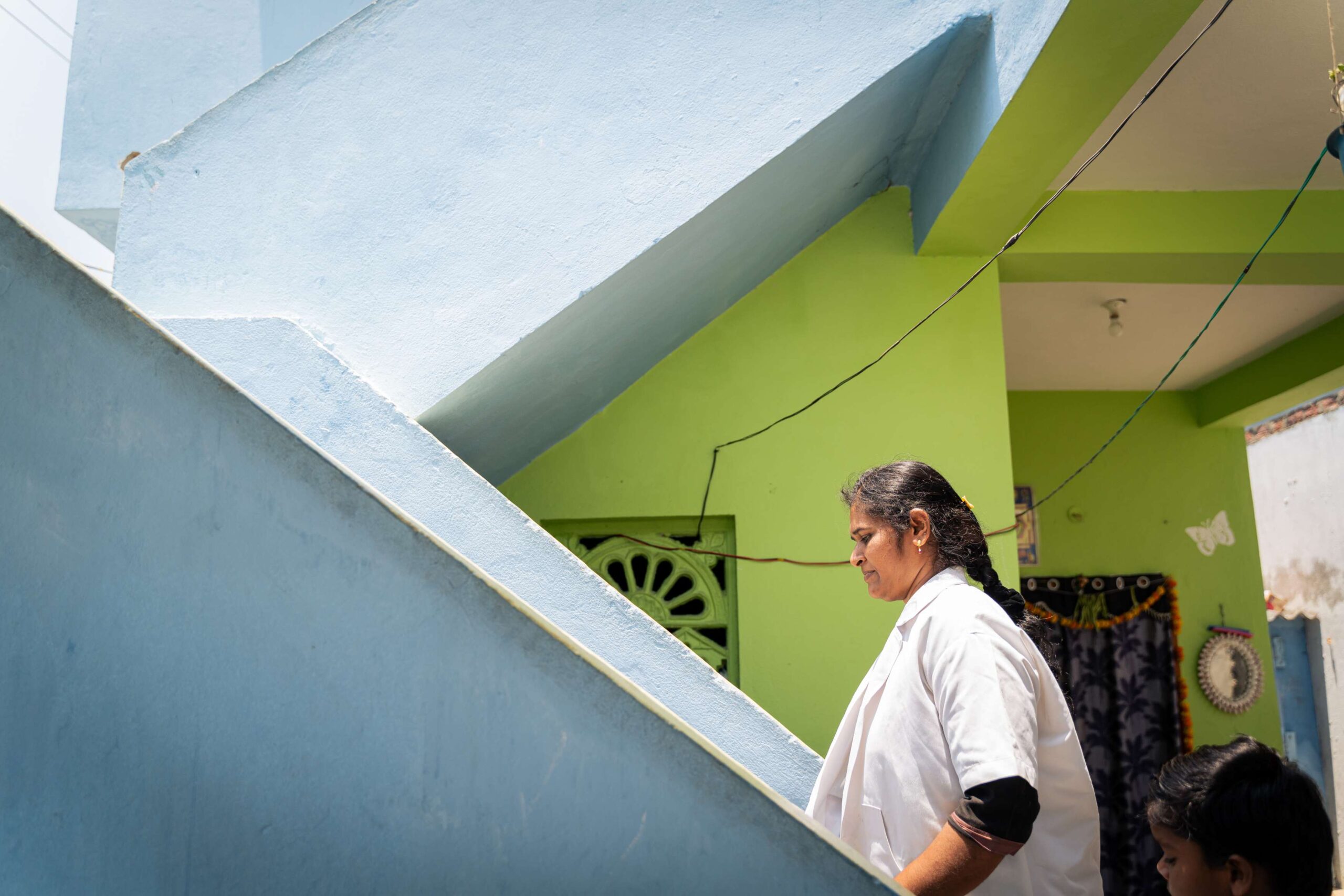 Walking up the steps of the local health and wellness center, Santhi reflects on her work as a Community Health Officer in Andhra Pradesh, India.